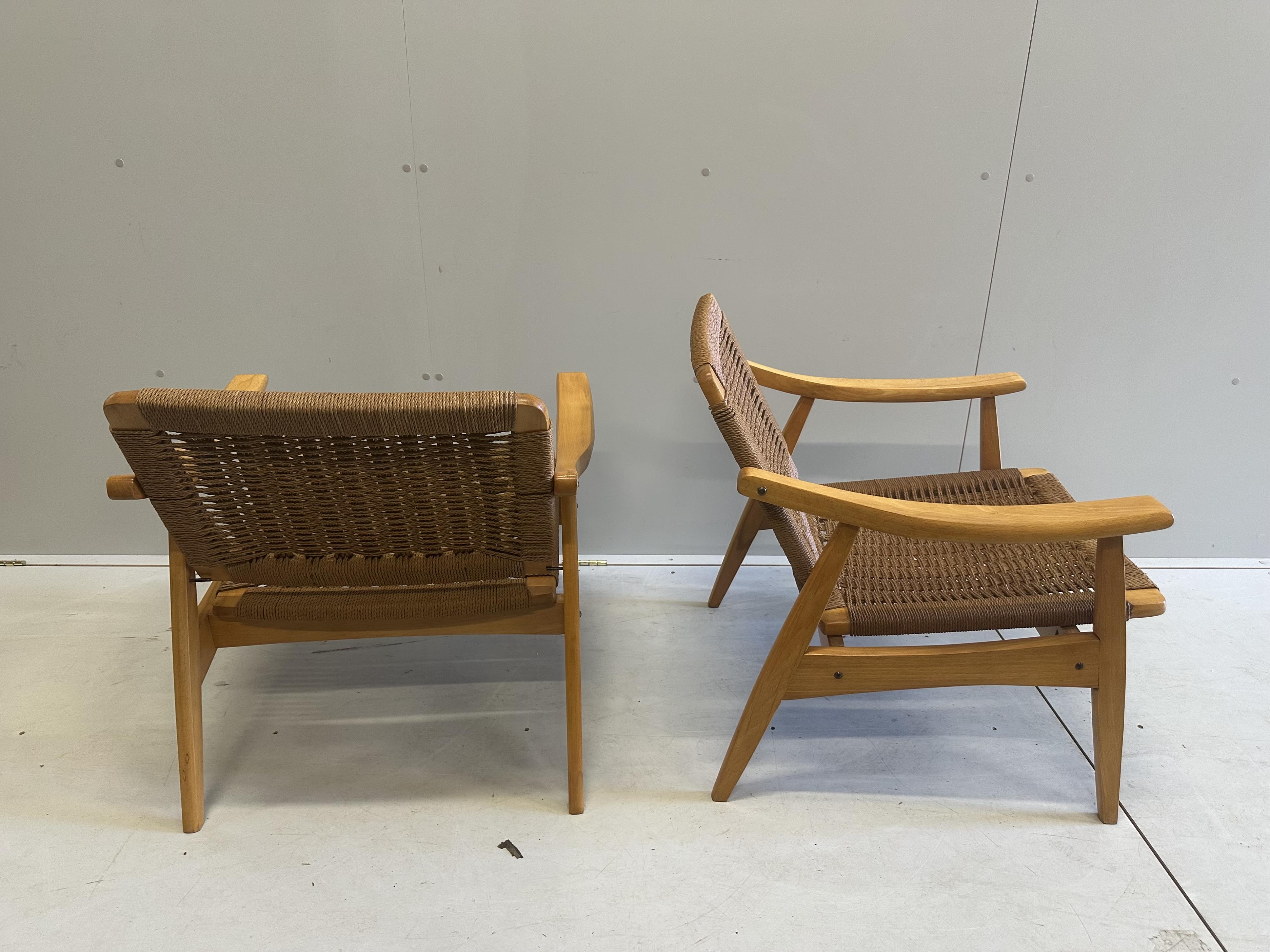 A mid century caned teak three piece lounge suite, settee width 174cm, depth 68cm, height 71cm. Condition - good